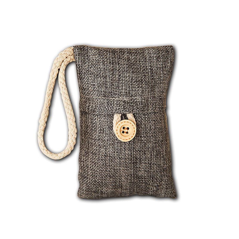 FreshPouch small charcoal odor-absorbing pouch hanging in a closet — eco-friendly bamboo charcoal for small spaces