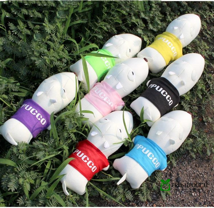 White light bulb-shaped toys with colorful bands labeled 'PUCCO' on grass.
