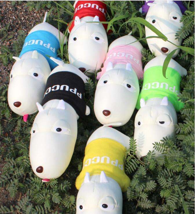 Colorful dog-shaped toys with 'Pugco' branding on a green leafy background
