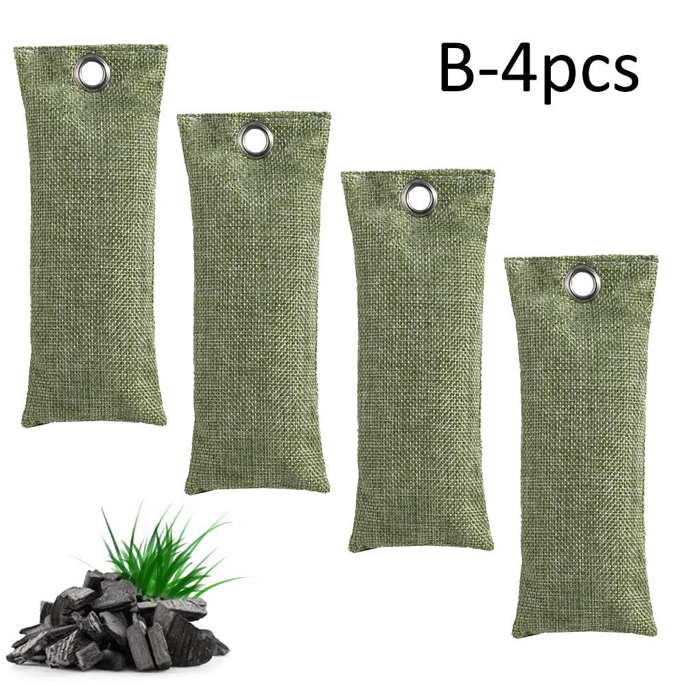 Four green fabric bags with charcoal briquettes on a white background