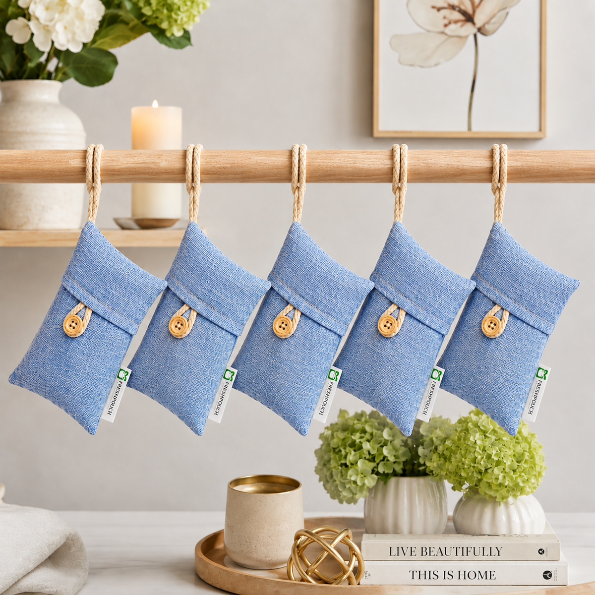 FreshPouch Reusable Odor pouches in blue woven fabric, each with a tan button and hanging loop, shown as a five-pack